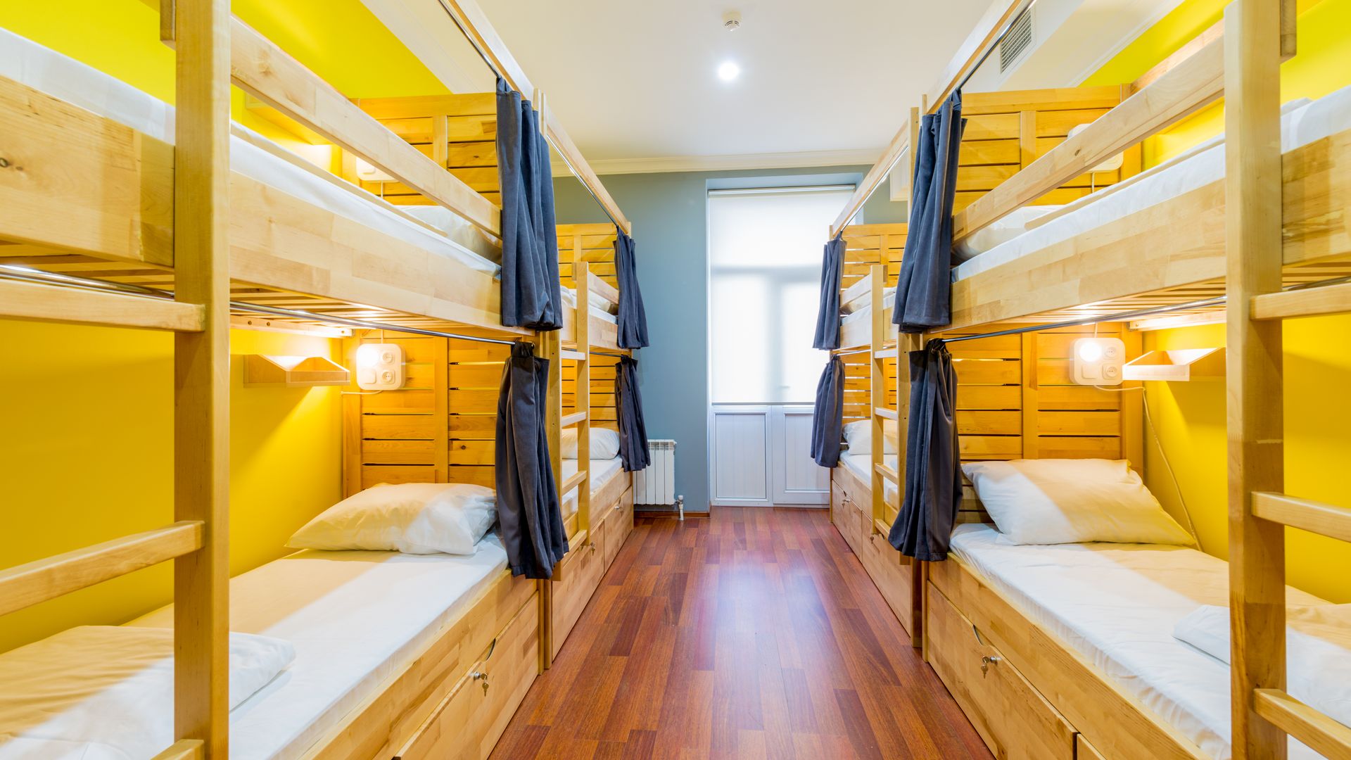 Hostel dormitory beds arranged in room
